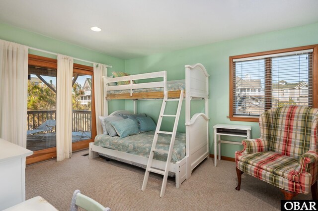 bedroom featuring access to exterior, recessed lighting, baseboards, and carpet floors