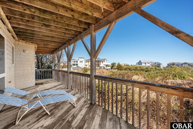 wooden terrace featuring a residential view