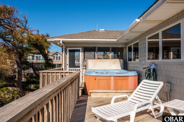 deck with a hot tub