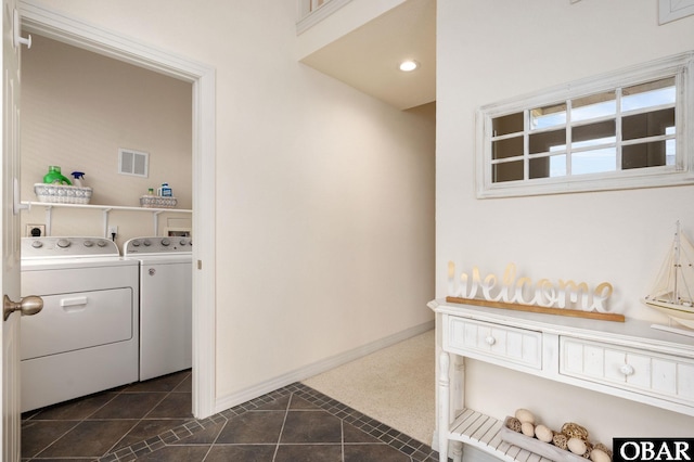 716 Moongate Ln Lot 51, Corolla, NC 27927 - washroom with washing machine and clothes dryer, baseboards, and dark tile patterned flooring