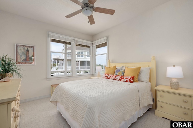716 Moongate Ln Lot 51, Corolla, NC 27927 - bedroom with baseboards, light carpet, and ceiling fan