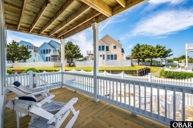 716 Moongate Ln Lot 51, Corolla, NC 27927 - wooden terrace with a fenced backyard and a residential view