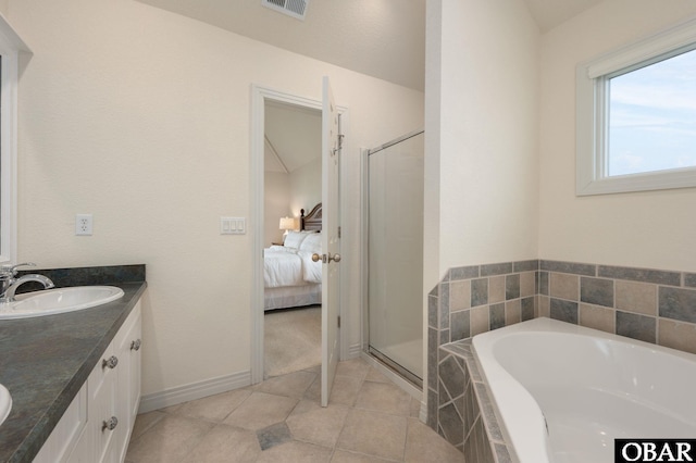 716 Moongate Ln Lot 51, Corolla, NC 27927 - ensuite bathroom featuring double vanity, a garden tub, tile patterned floors, a shower stall, and baseboards