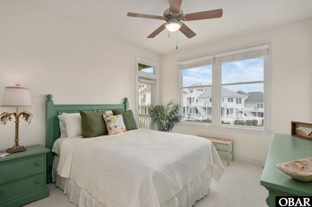716 Moongate Ln Lot 51, Corolla, NC 27927 - bedroom featuring light colored carpet, baseboards, and a ceiling fan