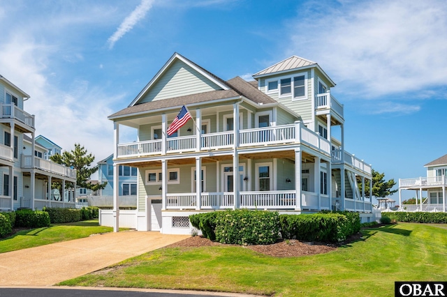 716 Moongate Ln Lot 51, Corolla, NC 27927 - view of front of home with a standing seam roof, a front yard, covered porch, and metal roof