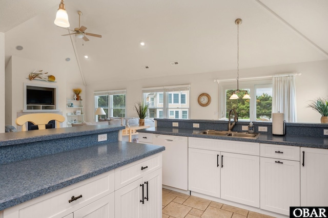 716 Moongate Ln Lot 51, Corolla, NC 27927 - kitchen with a sink, dishwasher, a ceiling fan, pendant lighting, and white cabinetry