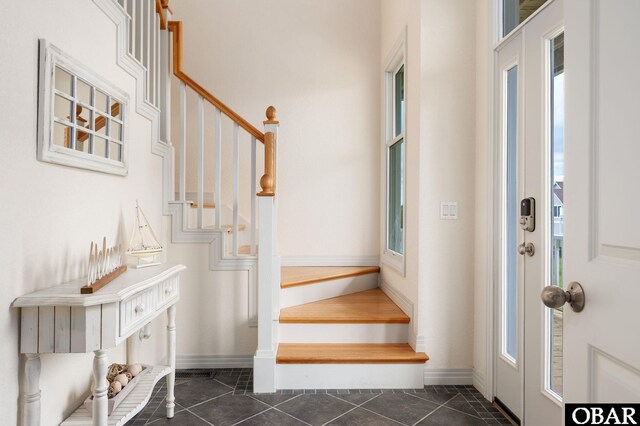 716 Moongate Ln Lot 51, Corolla, NC 27927 - entryway featuring stairway, baseboards, and dark tile patterned floors