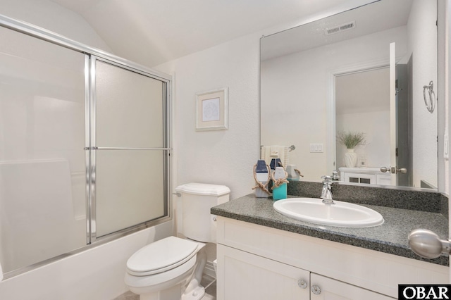 716 Moongate Ln Lot 51, Corolla, NC 27927 - bathroom with toilet, vanity, and enclosed tub / shower combo