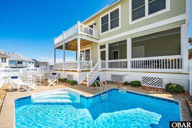 716 Moongate Ln Lot 51, Corolla, NC 27927 - swimming pool featuring fence, stairs, a ceiling fan, and a patio