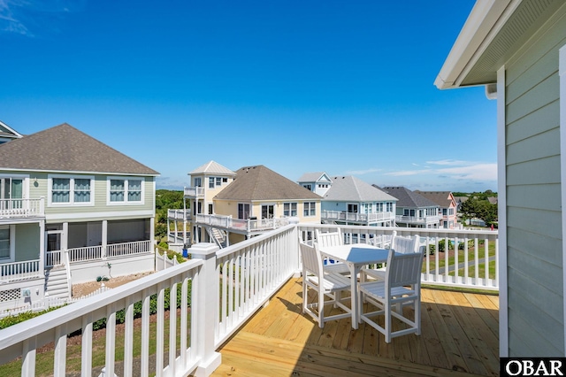 716 Moongate Ln Lot 51, Corolla, NC 27927 - wooden terrace with a residential view and outdoor dining area