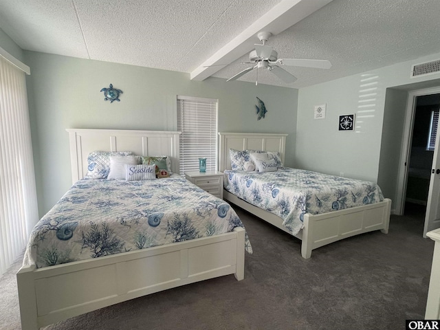 bedroom with a ceiling fan, a textured ceiling, visible vents, beam ceiling, and dark carpet