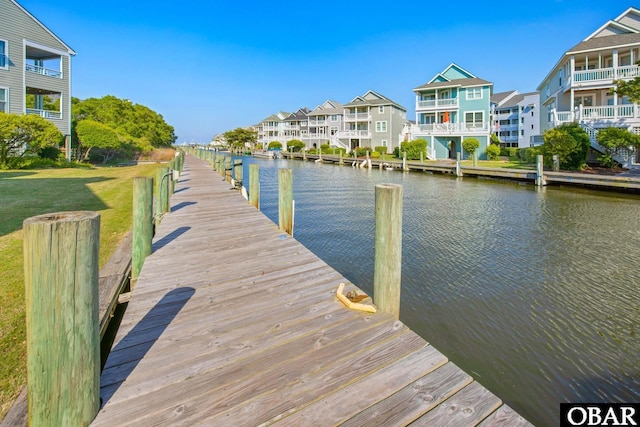 612 Pirates Way Unit # 612B, Manteo, NC 27954 - dock area with a water view, a residential view, and a yard