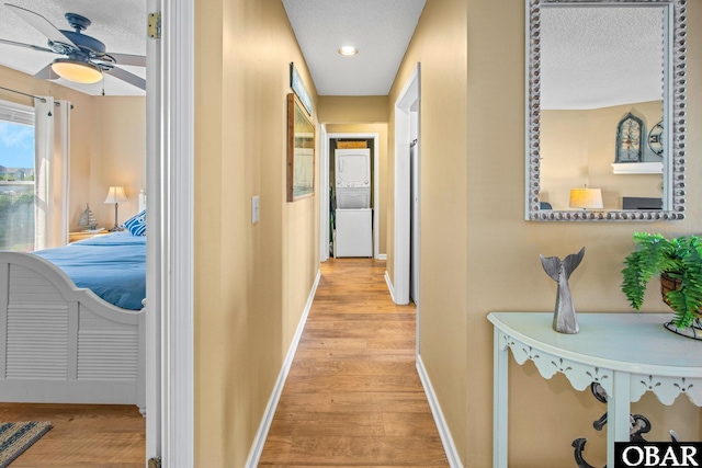 612 Pirates Way Unit # 612B, Manteo, NC 27954 - corridor with light wood-style flooring, baseboards, a textured ceiling, and recessed lighting
