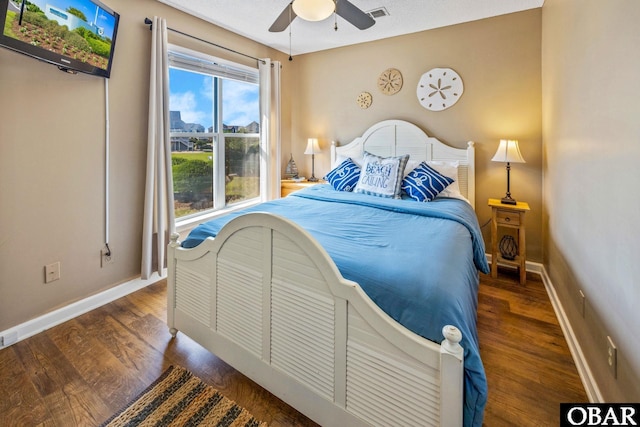 612 Pirates Way Unit # 612B, Manteo, NC 27954 - bedroom with wood finished floors, baseboards, and a ceiling fan