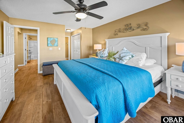 612 Pirates Way Unit # 612B, Manteo, NC 27954 - bedroom featuring wood finished floors, a closet, ceiling fan, a textured ceiling, and baseboards