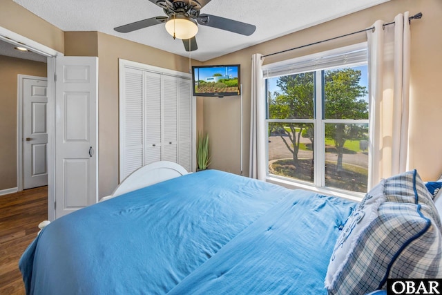 612 Pirates Way Unit # 612B, Manteo, NC 27954 - bedroom with wood finished floors, ceiling fan, baseboards, and a closet