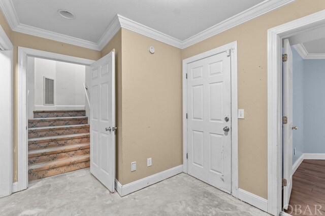 50336 Great Ridge Rd, Frisco, NC 27936 - foyer with visible vents, baseboards, stairway, unfinished concrete flooring, and crown molding