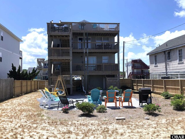 4023 Lindbergh Ave Lot # 65, Kitty Hawk, NC 27949 - back of property featuring a patio and a fenced backyard
