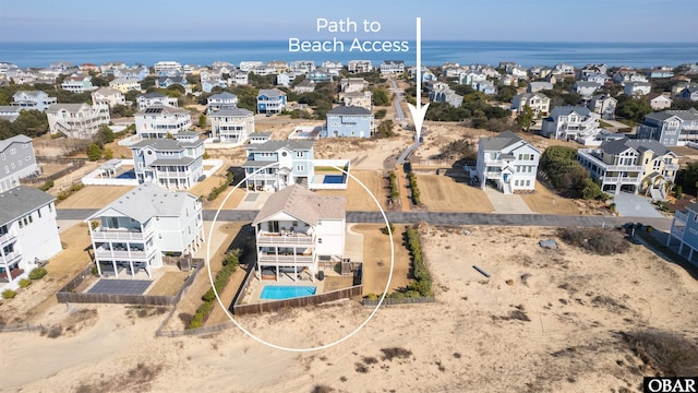 bird's eye view with a water view and a residential view