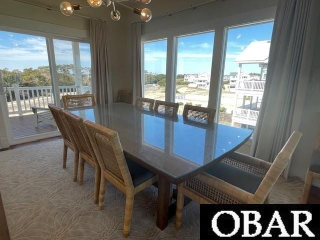 dining area featuring a notable chandelier