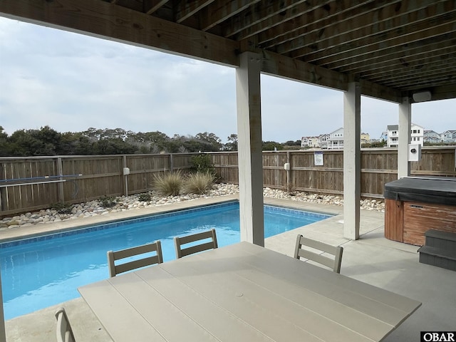 view of pool with a fenced backyard, a fenced in pool, a patio, and outdoor dining space