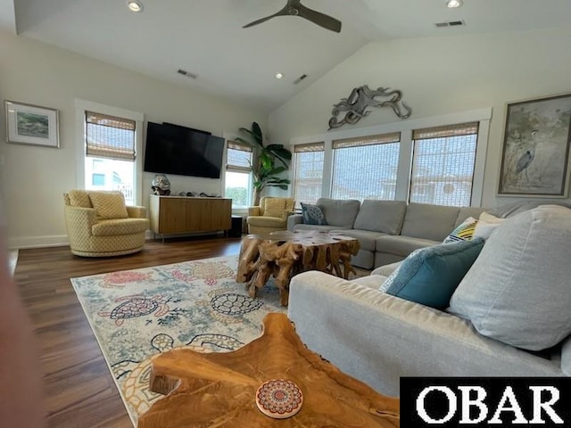 living area featuring lofted ceiling, visible vents, wood finished floors, and recessed lighting