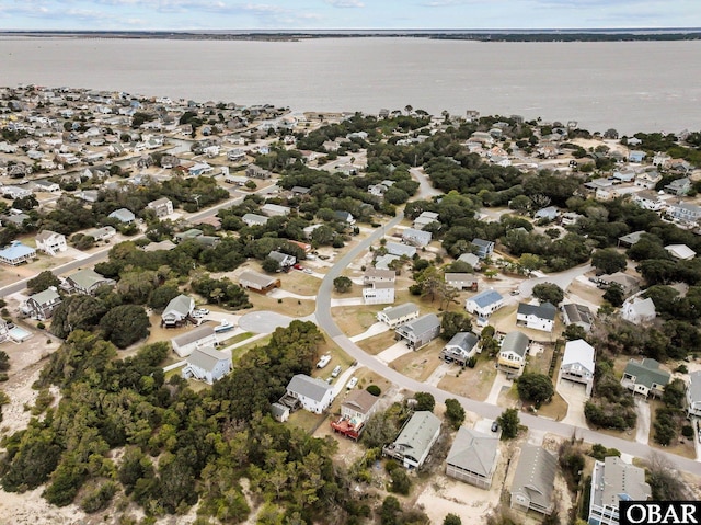 birds eye view of property with a water view and a residential view