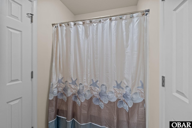 bathroom with curtained shower