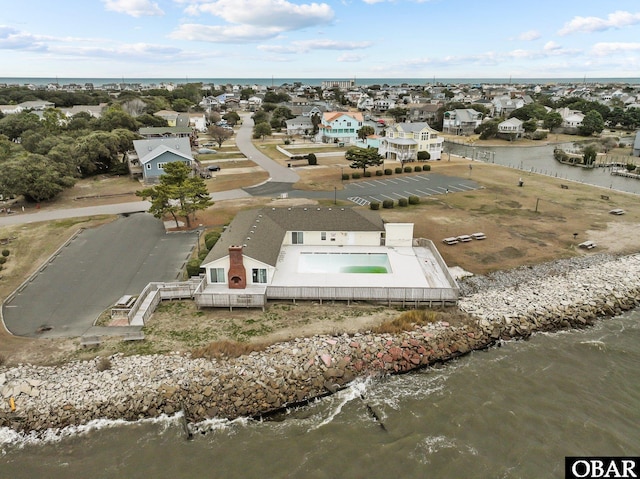 bird's eye view featuring a water view and a residential view