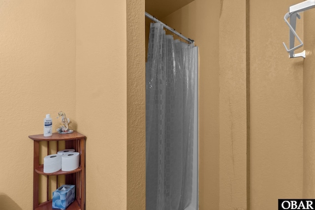 bathroom with curtained shower