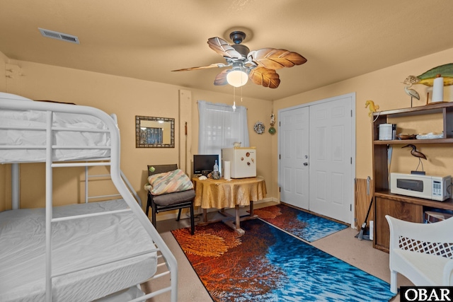 bedroom featuring visible vents and a ceiling fan