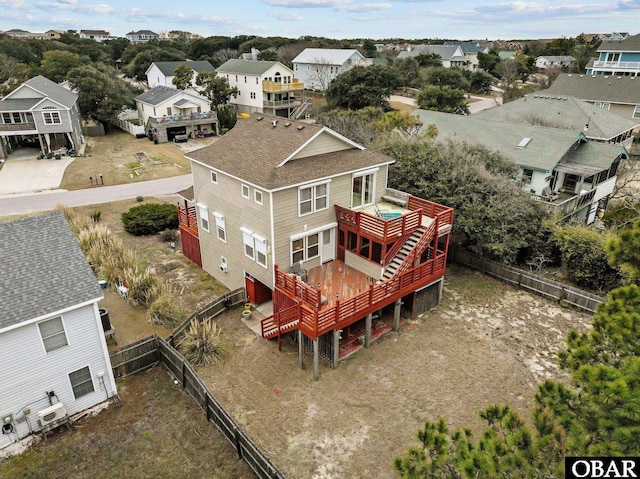 birds eye view of property with a residential view