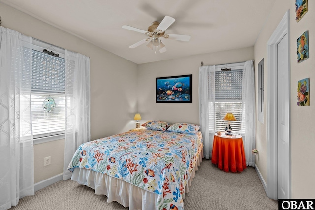 carpeted bedroom featuring ceiling fan and baseboards