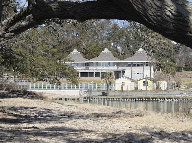 rear view of property featuring a water view