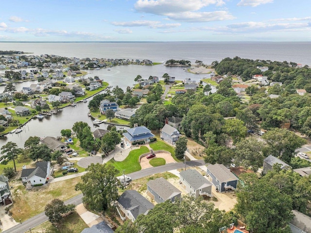 bird's eye view featuring a water view and a residential view