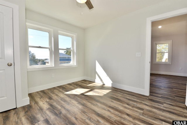 unfurnished room with baseboards, dark wood finished floors, a ceiling fan, and recessed lighting