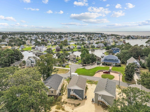 bird's eye view with a residential view and a water view