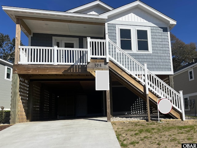 view of front of property with a porch and stairs