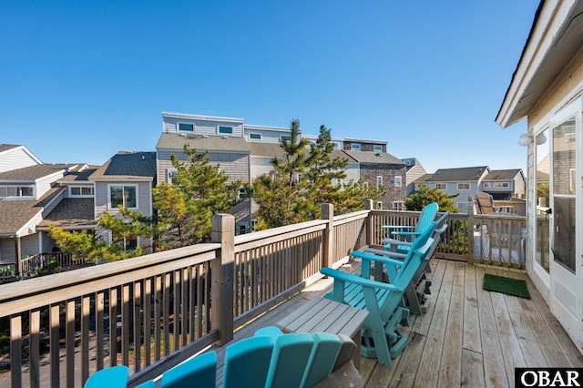 wooden deck featuring a residential view