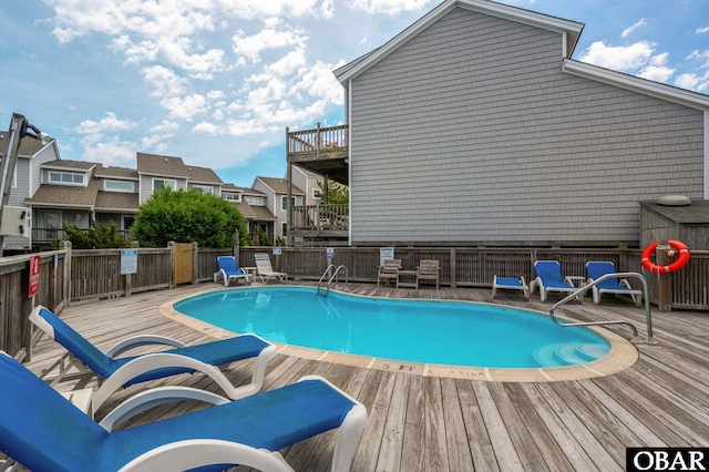 pool featuring a residential view and a wooden deck