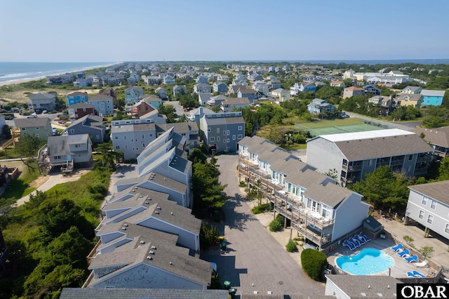 drone / aerial view featuring a water view and a residential view