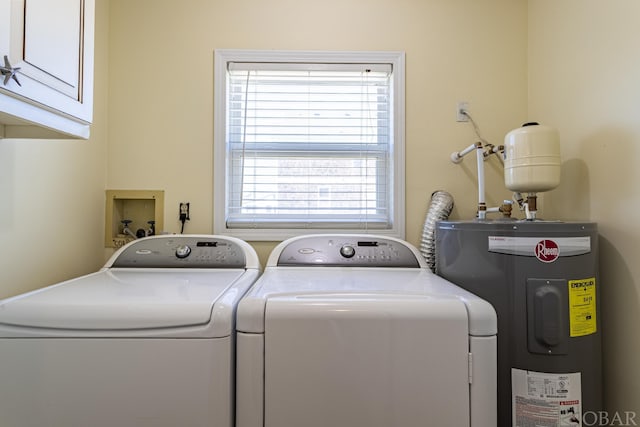 laundry area with cabinet space, independent washer and dryer, and electric water heater