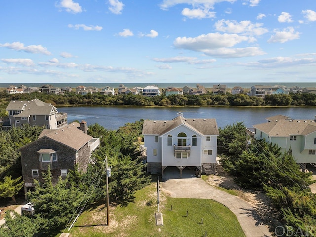 aerial view featuring a residential view and a water view