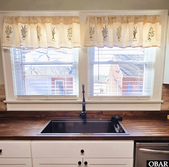 1034 N NC Highway 37, Gates, NC 27937 - room details featuring stainless steel dishwasher, white cabinetry, and a sink