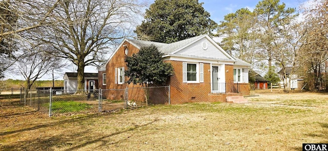 view of front facade featuring crawl space, fence, a front lawn, and brick siding