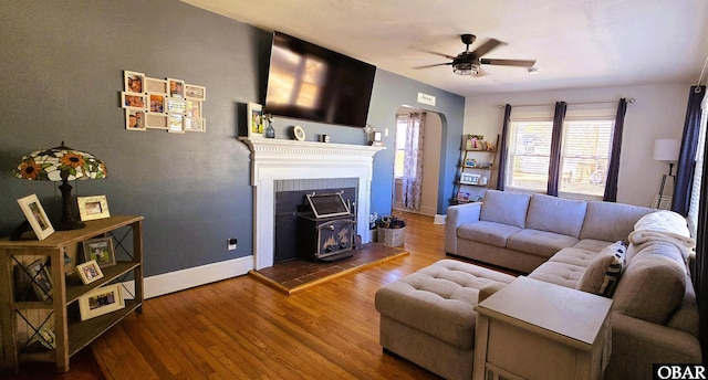 1034 N NC Highway 37, Gates, NC 27937 - living area with arched walkways, a ceiling fan, wood finished floors, and baseboards