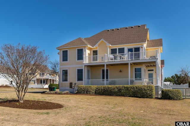 715 Ridge Point Dr Lot 20, Corolla, NC 27927 - back of property featuring a lawn, a balcony, and a shingled roof