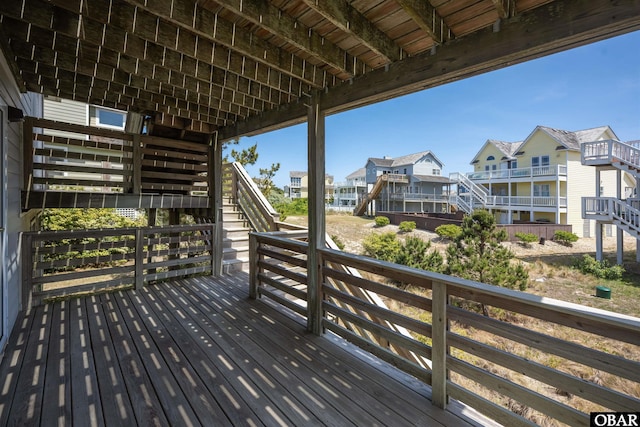 deck featuring a residential view and stairway
