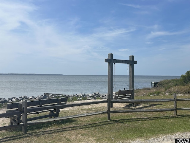 view of water feature with fence