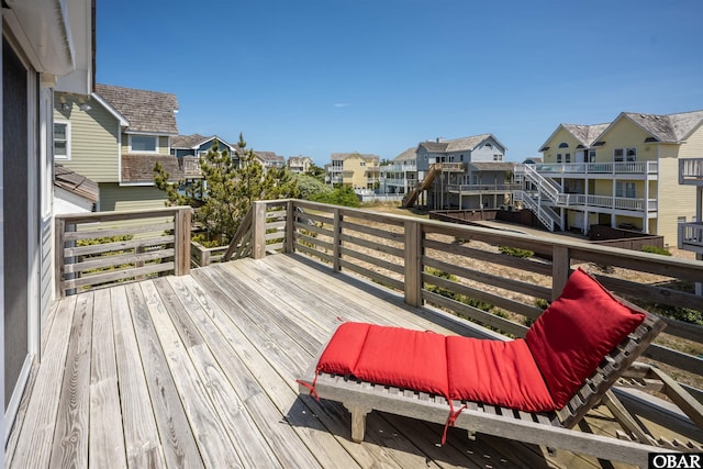 wooden terrace with a residential view